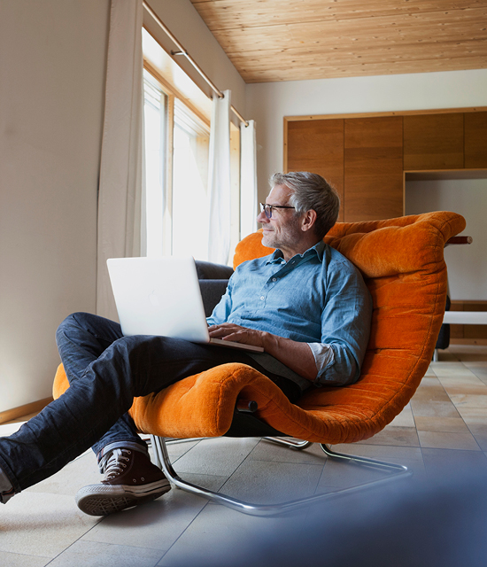 Man in chair with laptop