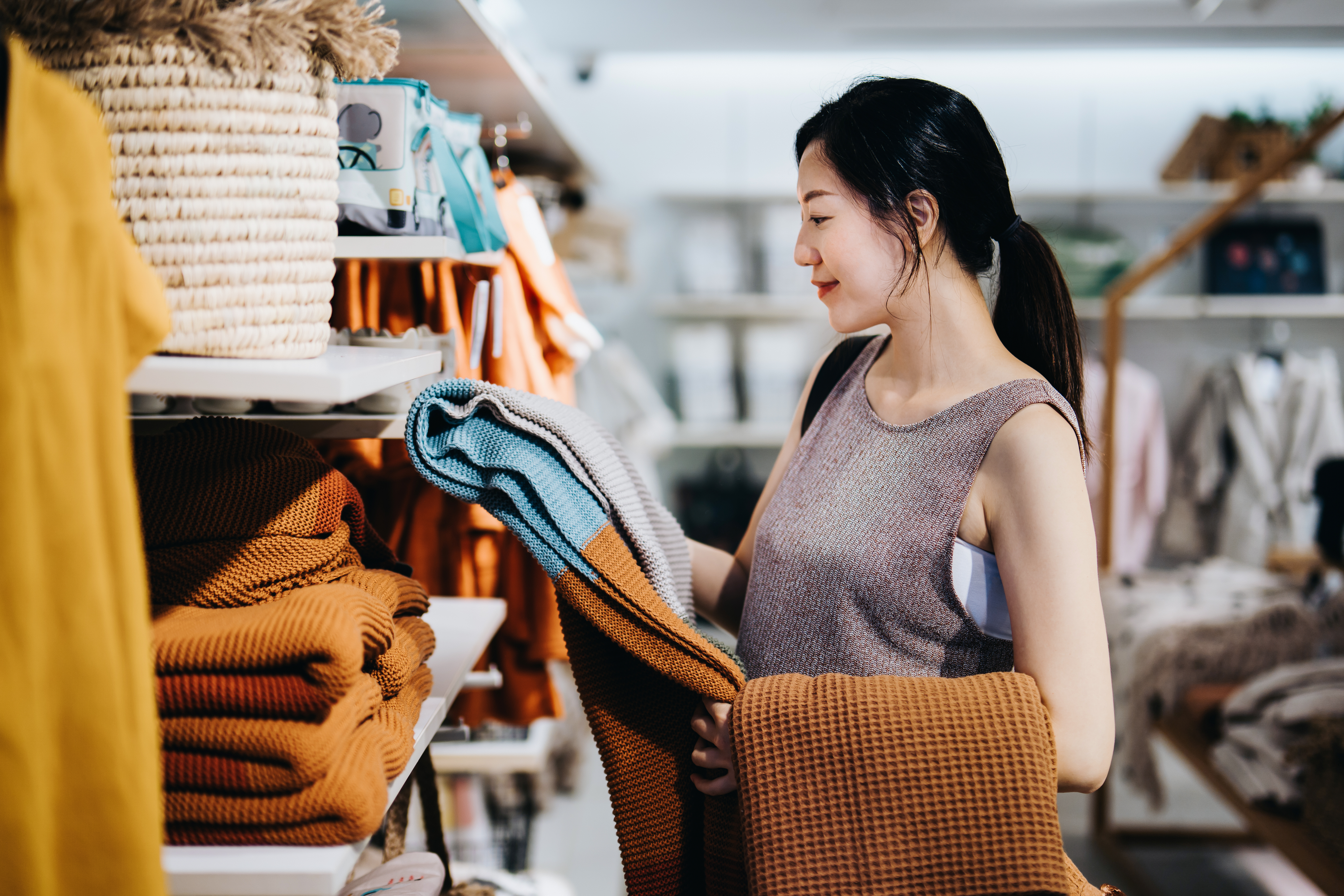 A girl shopping for Sweatshirt